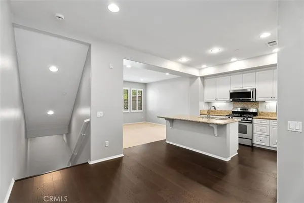 a view of kitchen with microwave and stove