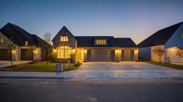 a view of a house with basketball court
