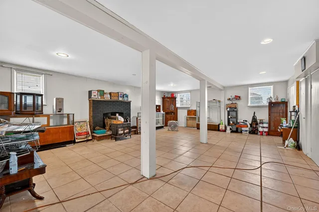 a view of a livingroom with lounge chair and a window