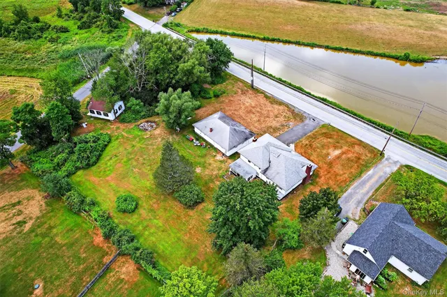 an aerial view of residential houses with outdoor space