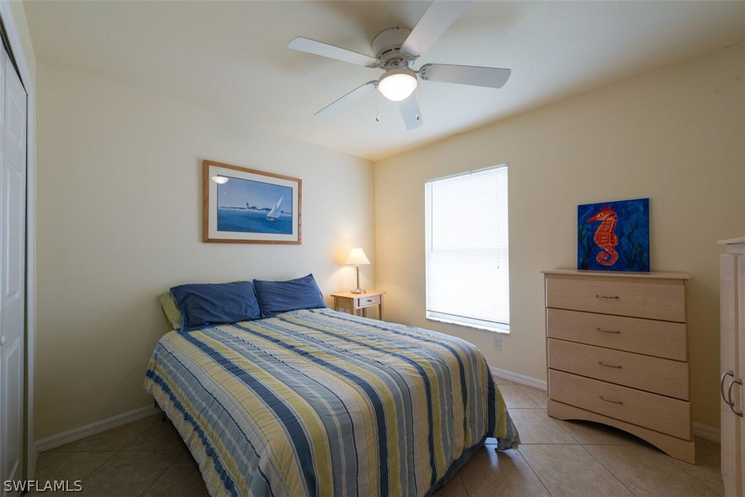 7274 Myrtle Road Fort Myers, FL 33967 - Photo 18 of 25 a bedroom with a bed and a cabinet