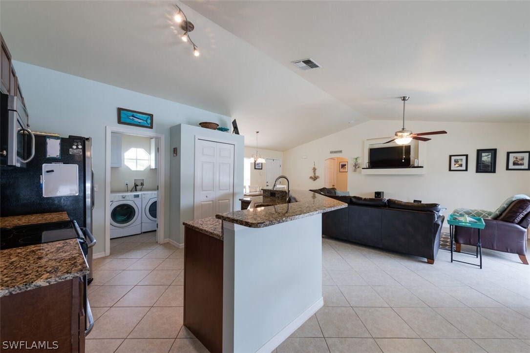 7274 Myrtle Road Fort Myers, FL 33967 - Photo 9 of 25 a living room with furniture and a flat screen tv