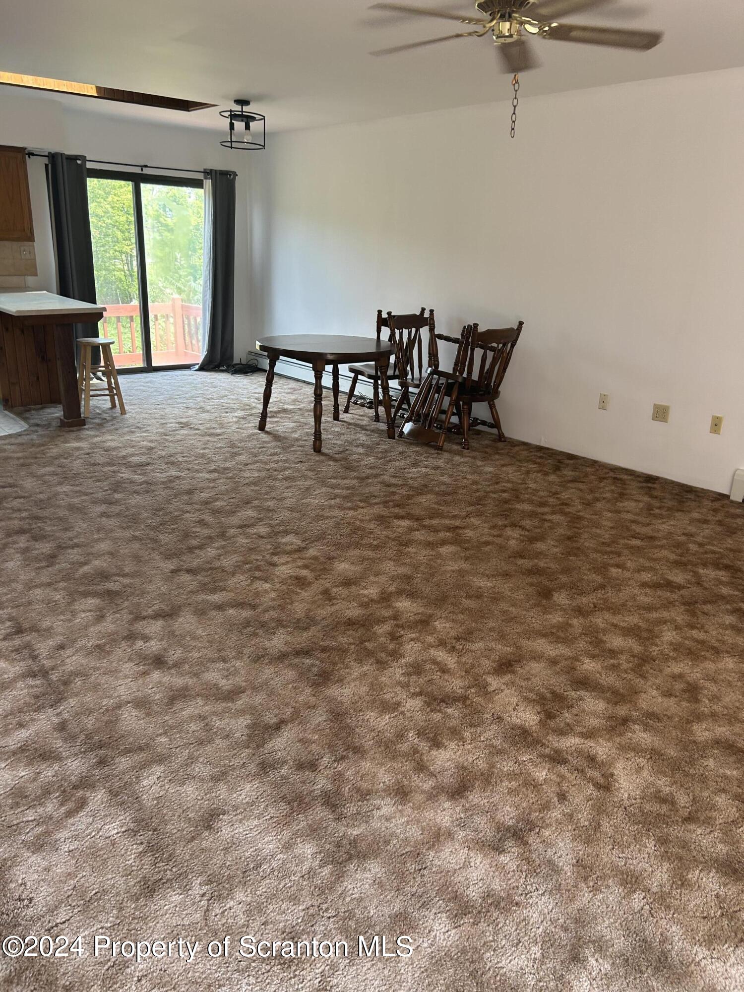 80 Worth Church Road Jermyn, PA 18433 - Photo 12 of 16 a view of a livingroom with furniture and window
