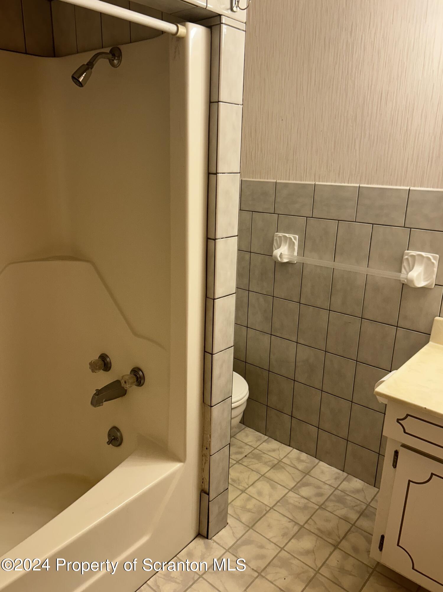 80 Worth Church Road Jermyn, PA 18433 - Photo 5 of 16 a bathroom with a bathtub and a shower