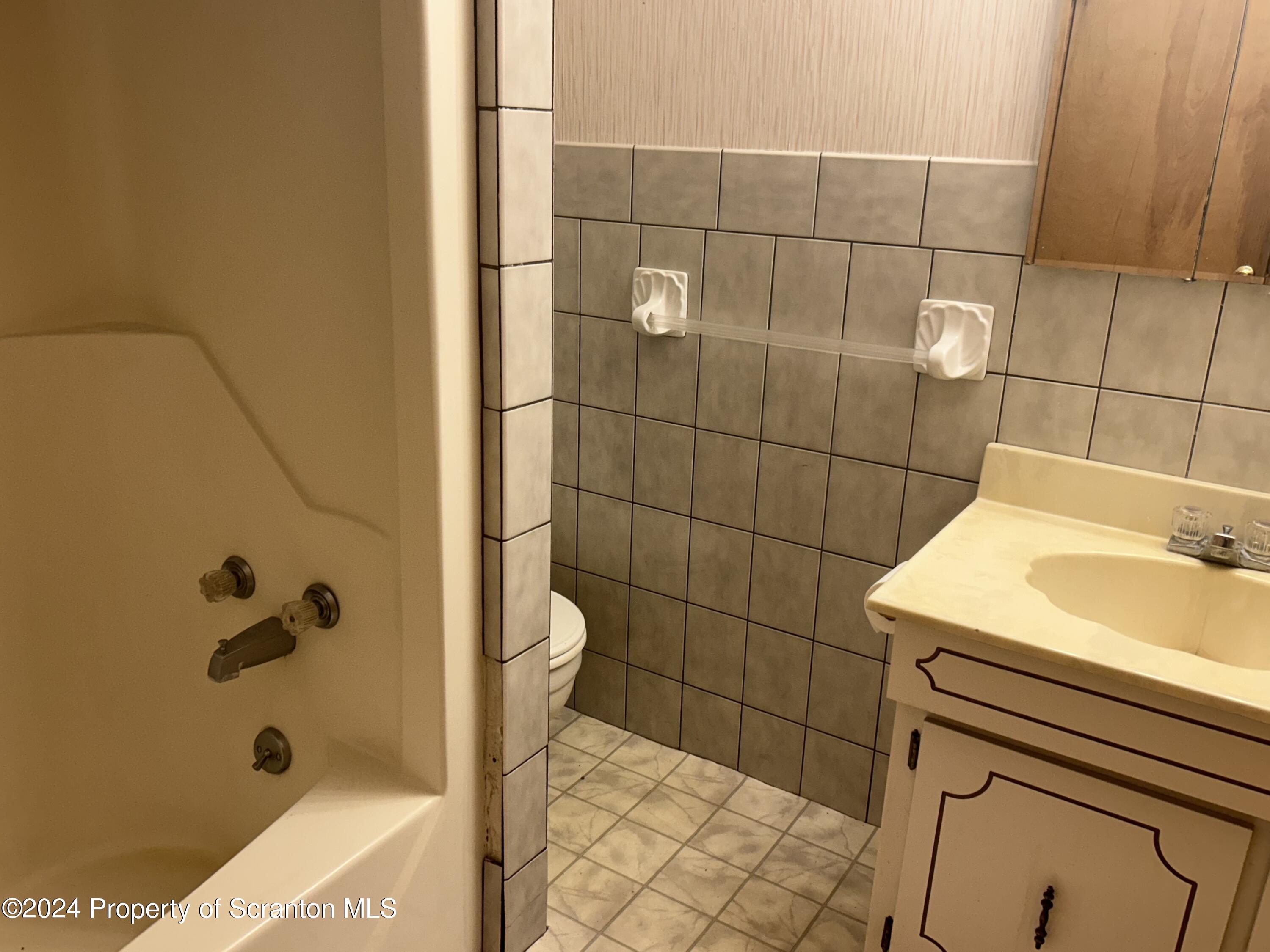 80 Worth Church Road Jermyn, PA 18433 - Photo 6 of 16 a bathroom with a sink and a shower