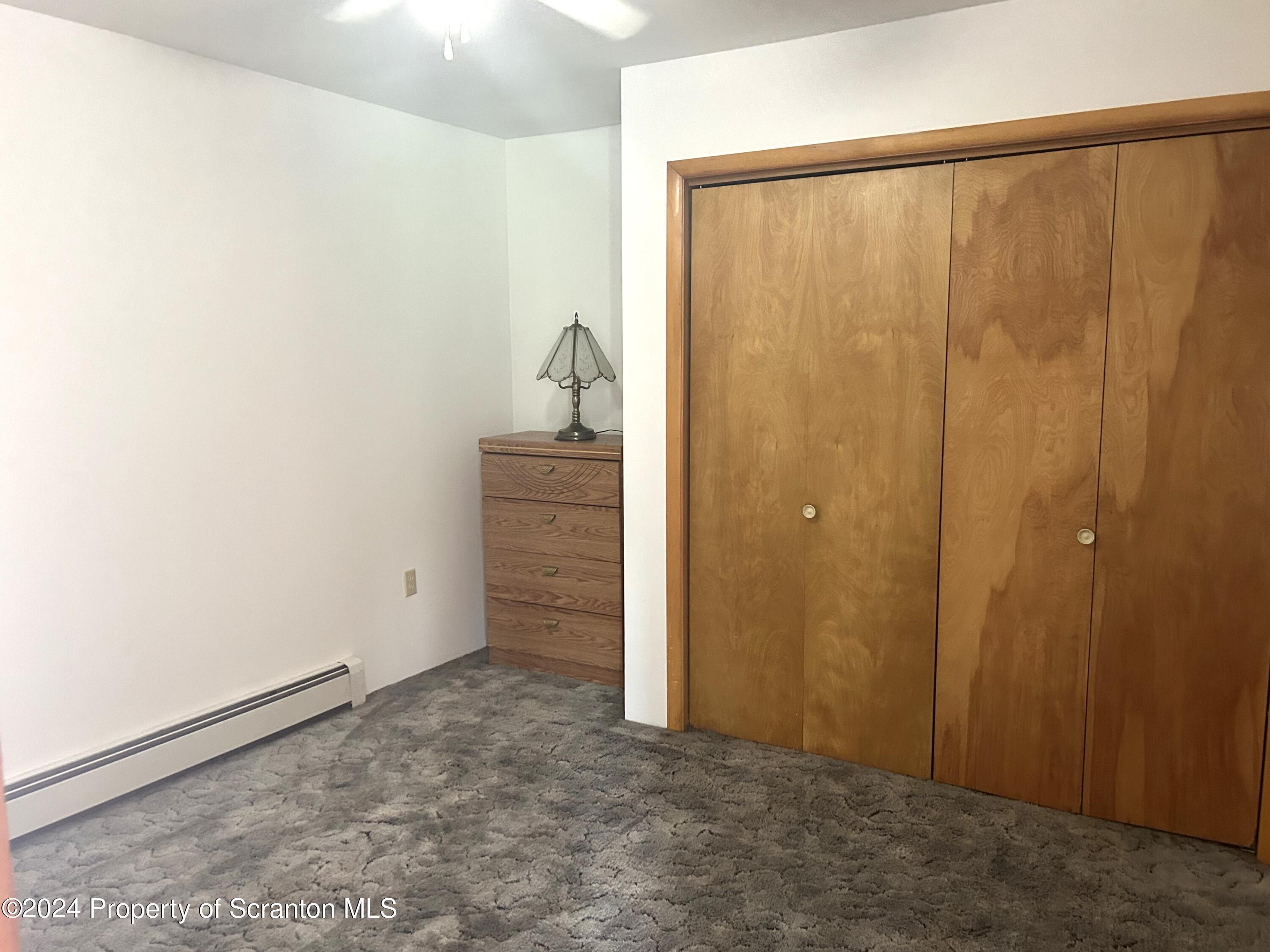 80 Worth Church Road Jermyn, PA 18433 - Photo 8 of 16 an empty room with a door