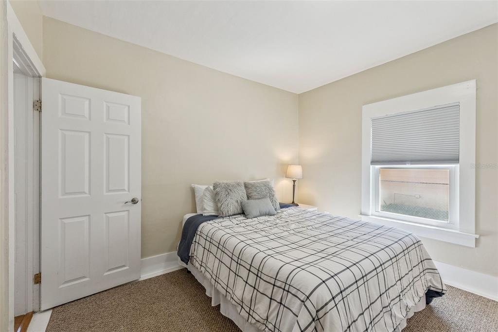 5108 South Ridgewood Avenue Port Orange, FL 32127 - Photo 14 of 44 a bedroom with a bed and a window