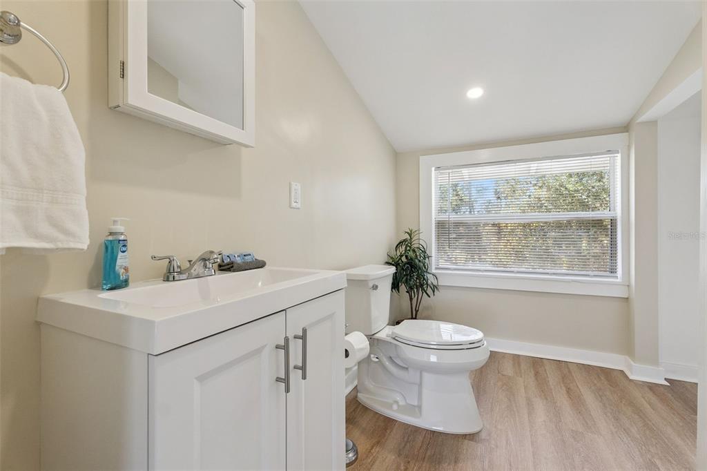 5108 South Ridgewood Avenue Port Orange, FL 32127 - Photo 18 of 44 a view of bathroom with a sink and mirror