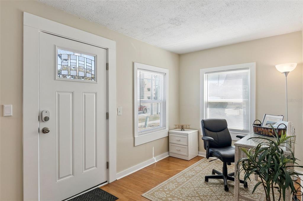 5108 South Ridgewood Avenue Port Orange, FL 32127 - Photo 2 of 44 a view of a workspace with furniture and a window