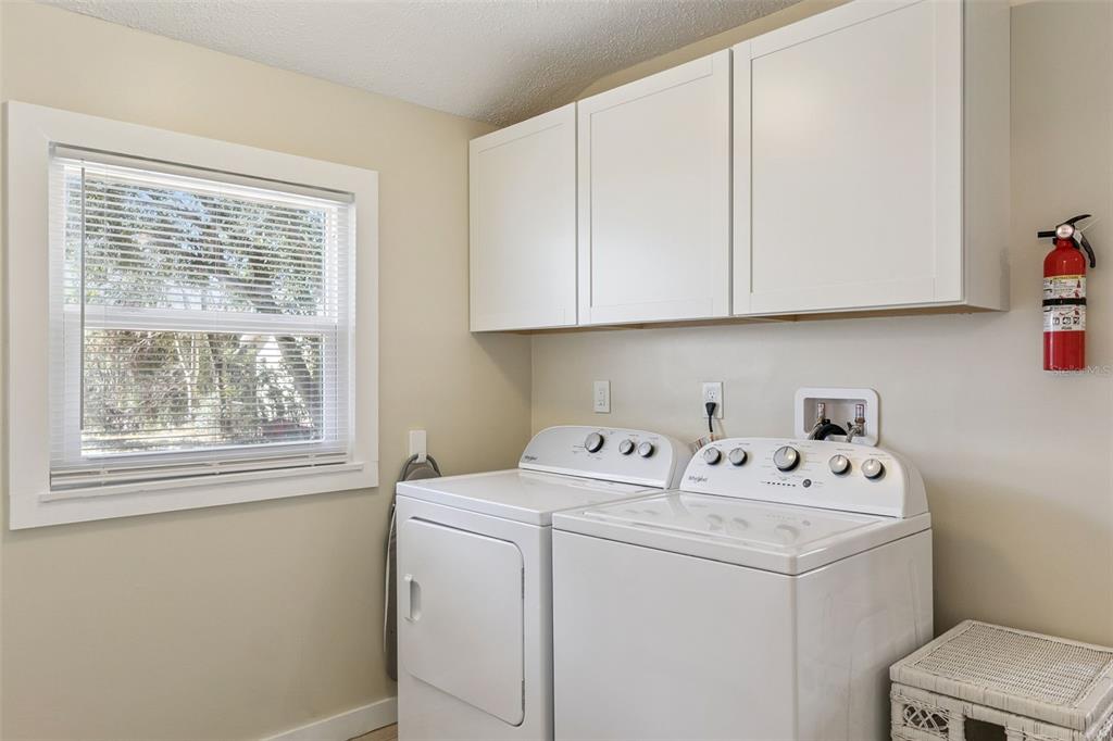 5108 South Ridgewood Avenue Port Orange, FL 32127 - Photo 22 of 44 a utility room with dryer and washer