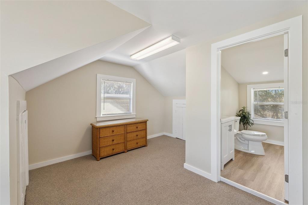 5108 South Ridgewood Avenue Port Orange, FL 32127 - Photo 26 of 44 a room with a bed and a view of bathroom