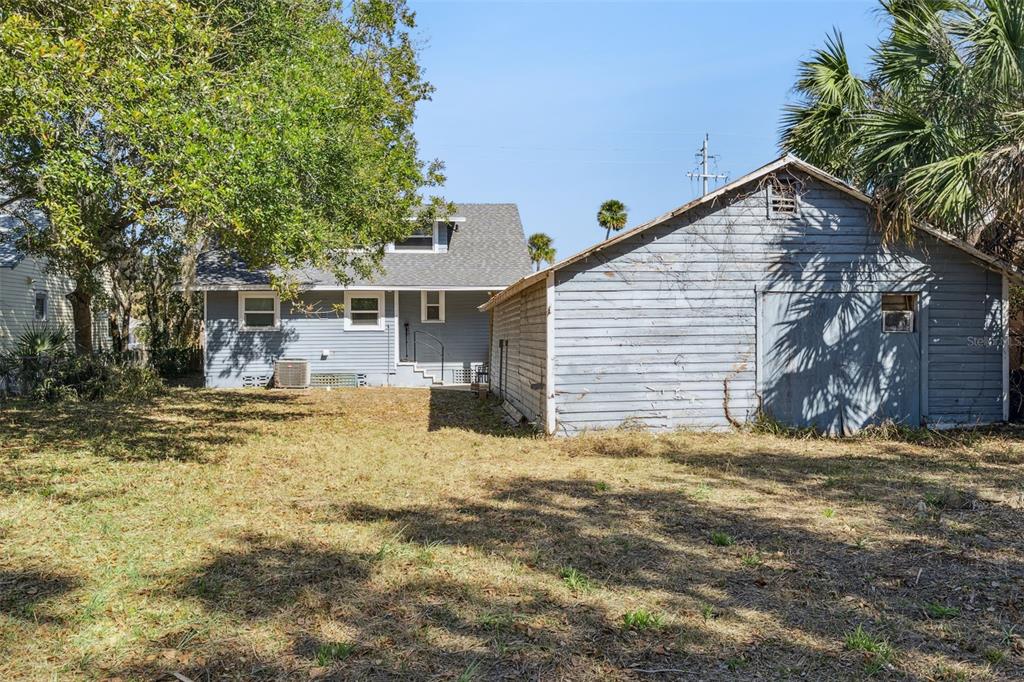 5108 South Ridgewood Avenue Port Orange, FL 32127 - Photo 35 of 44 a view of a house with a yard