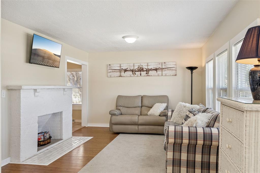 5108 South Ridgewood Avenue Port Orange, FL 32127 - Photo 6 of 44 a living room with furniture and a fireplace