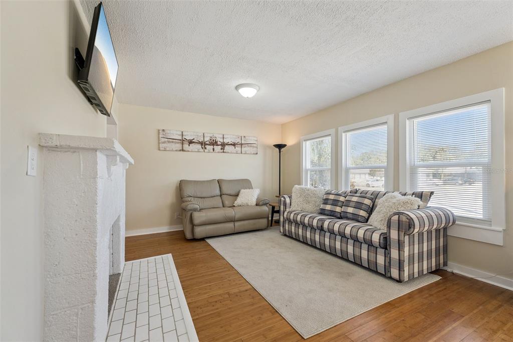 5108 South Ridgewood Avenue Port Orange, FL 32127 - Photo 7 of 44 a living room with furniture and a flat screen tv