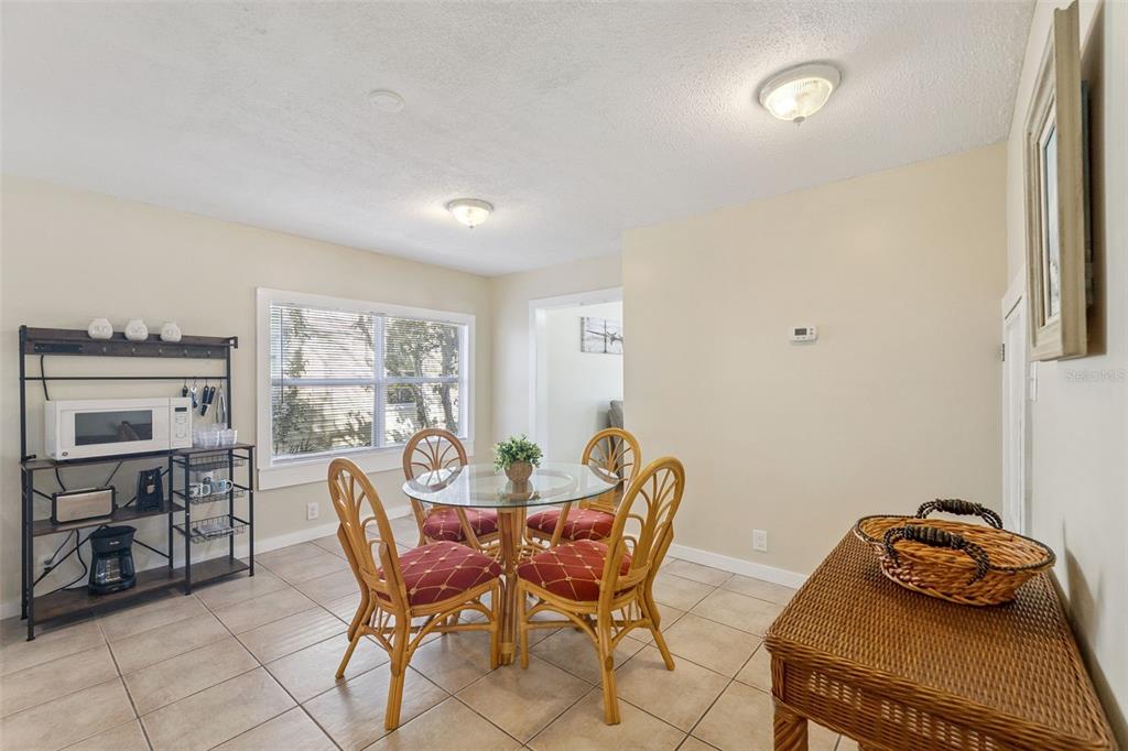 5108 South Ridgewood Avenue Port Orange, FL 32127 - Photo 9 of 44 a dining room with furniture and window
