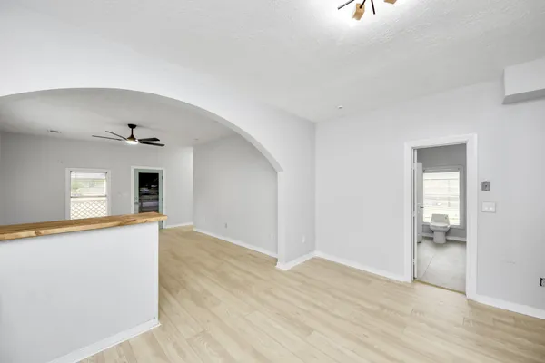 a kitchen with a refrigerator sink and cabinets