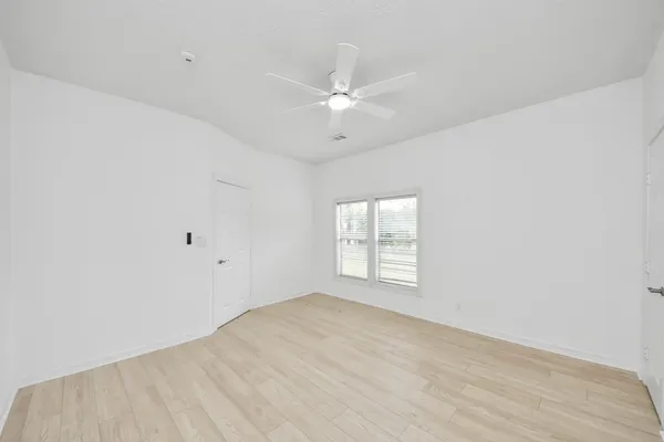 a view of a bedroom from a hallway