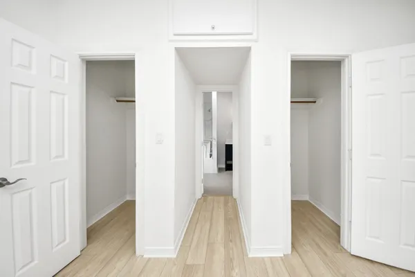 a kitchen with granite countertop white cabinets and appliances