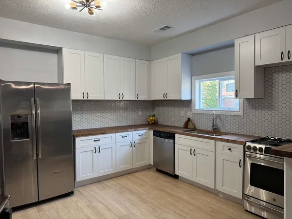 a bathroom with a sink vanity and a mirror