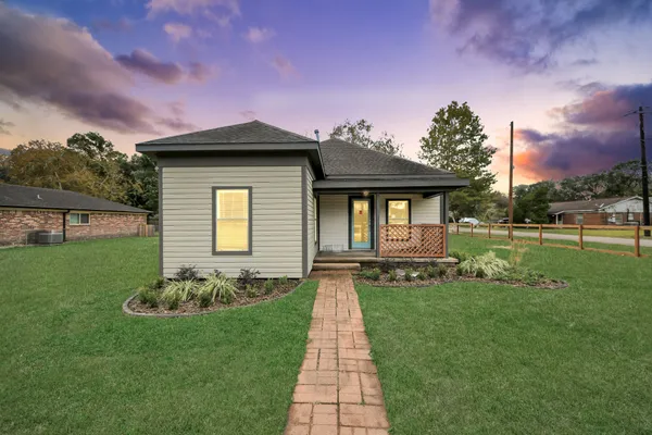 a front view of a house with a yard