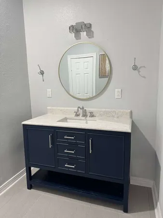 a living room with a couch and a stove top oven