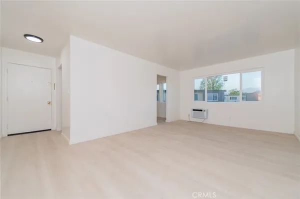 a view of an empty room with a window