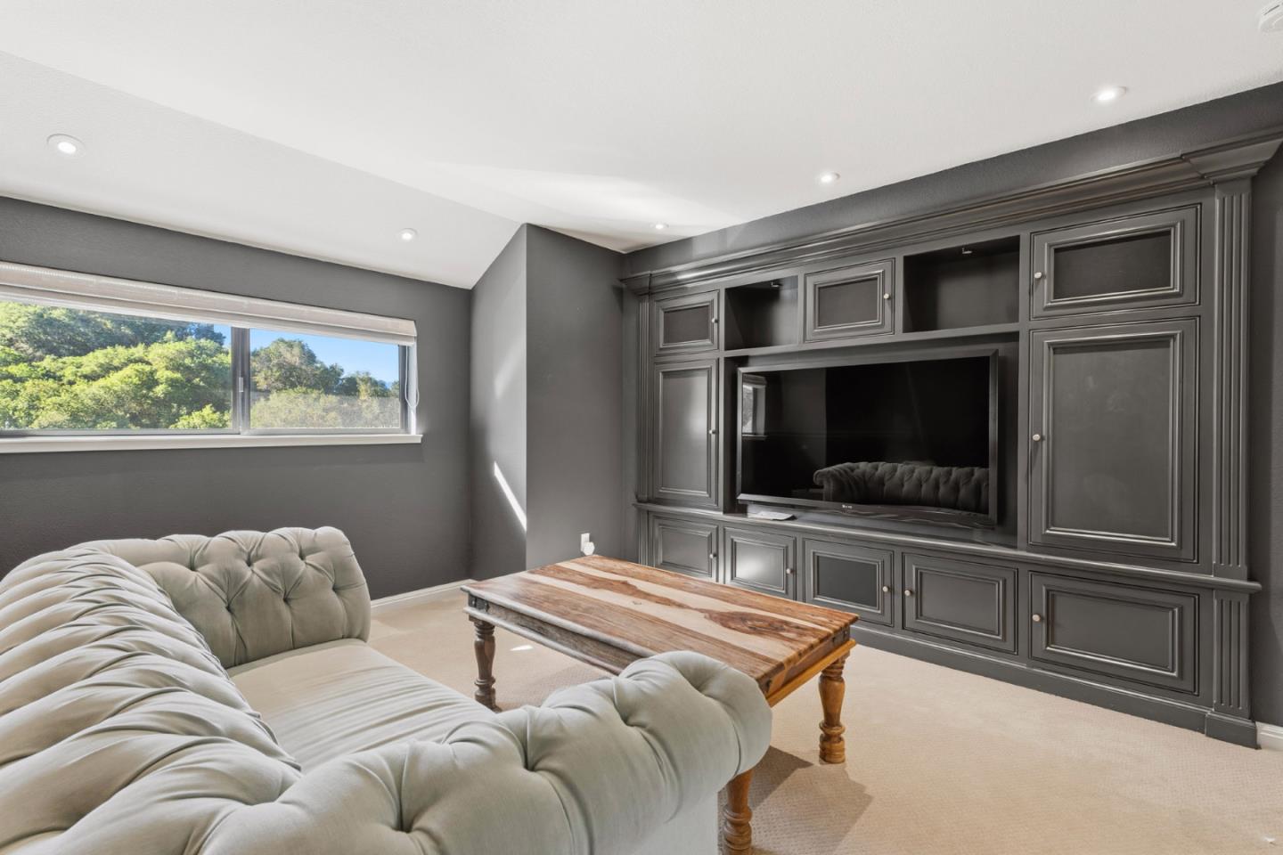 15965 Shannon Road Los Gatos, CA 95032 - Photo 14 of 53 a bedroom with furniture and a flat screen tv