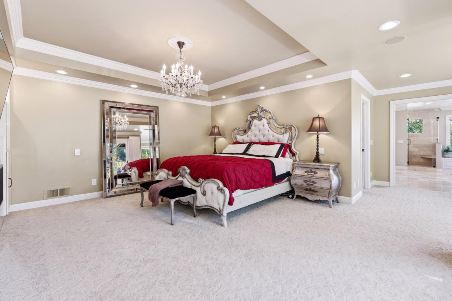 15965 Shannon Road Los Gatos, CA 95032 - Photo 16 of 53 a bedroom with bed and a chandelier
