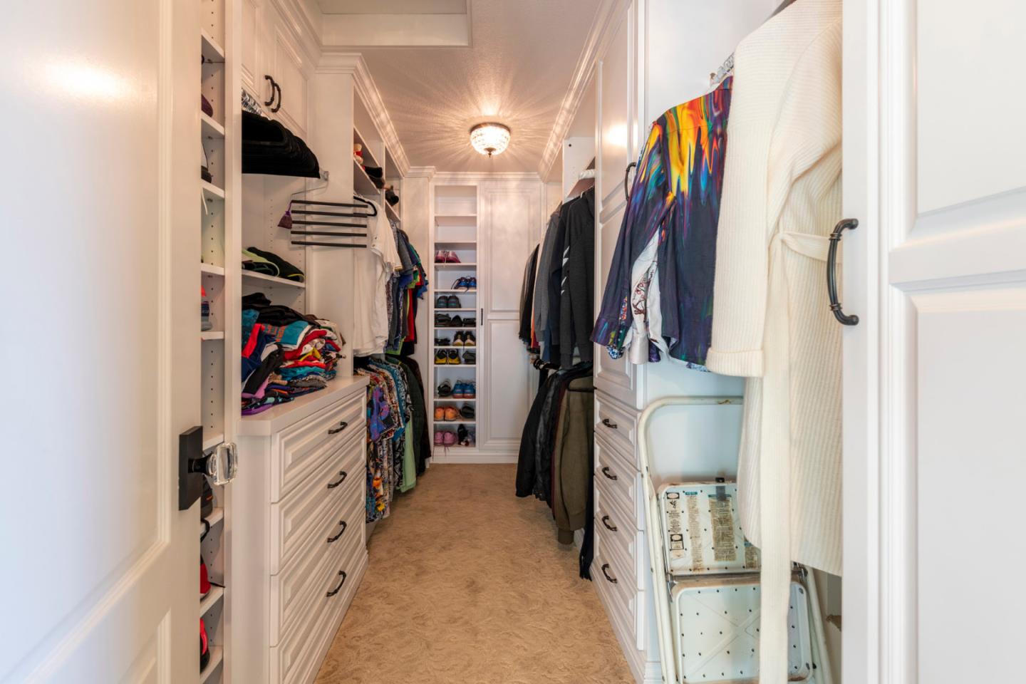 15965 Shannon Road Los Gatos, CA 95032 - Photo 28 of 53 a view of walk in closet with clothes and shoes