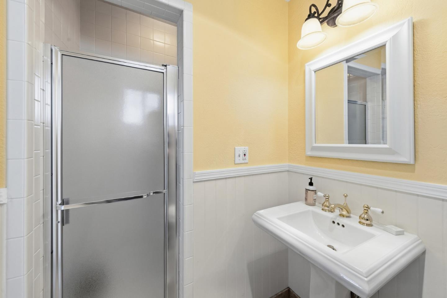 15965 Shannon Road Los Gatos, CA 95032 - Photo 42 of 53 a bathroom with a sink mirror and vanity