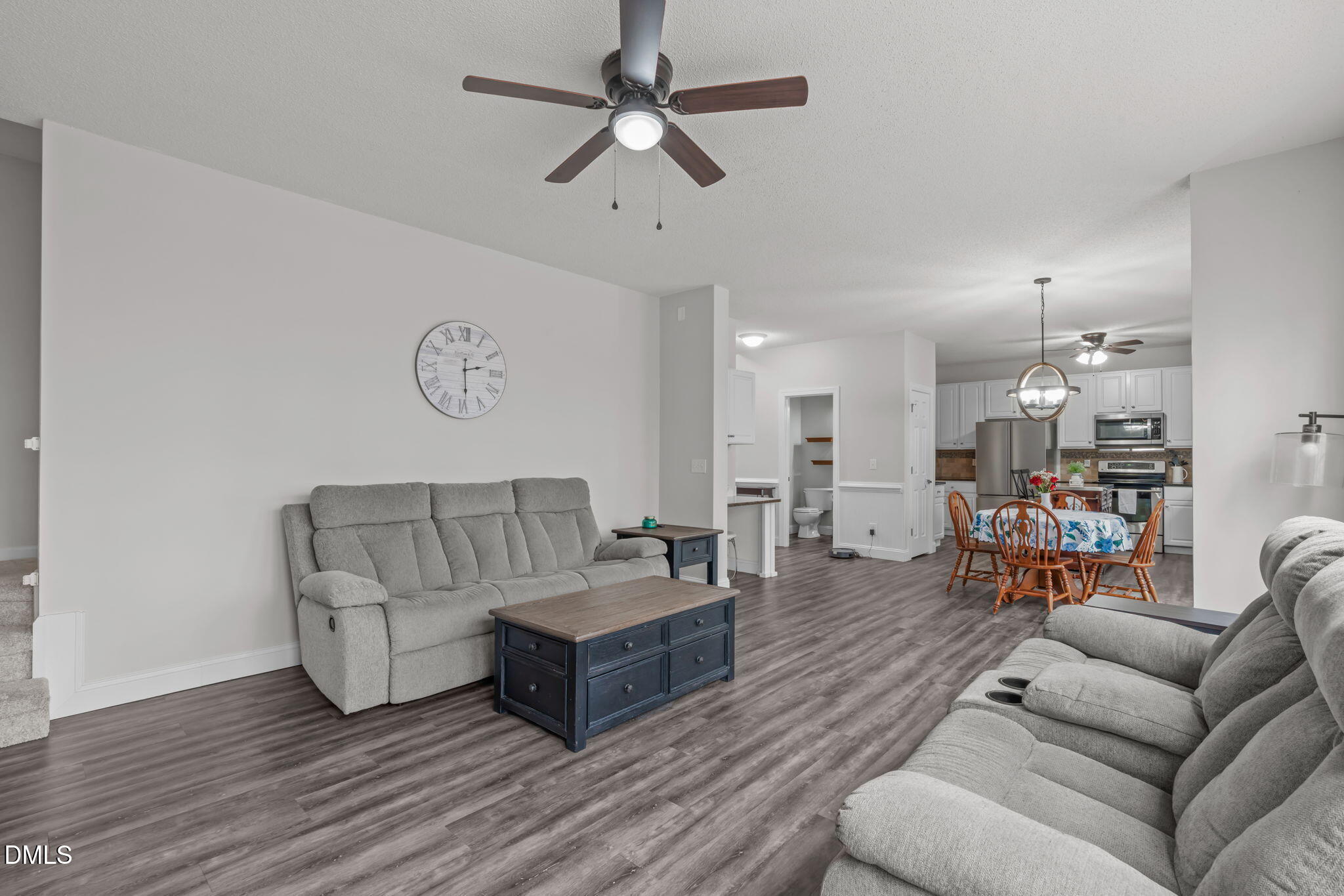2501 Springfield Park Drive Raleigh, NC 27614 - Photo 19 of 44 a living room with furniture and a wooden floor