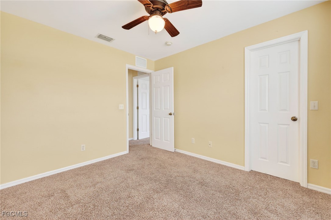 4664 Varsity Circle Lehigh Acres, FL 33971 - Photo 13 of 31 a view of an empty room