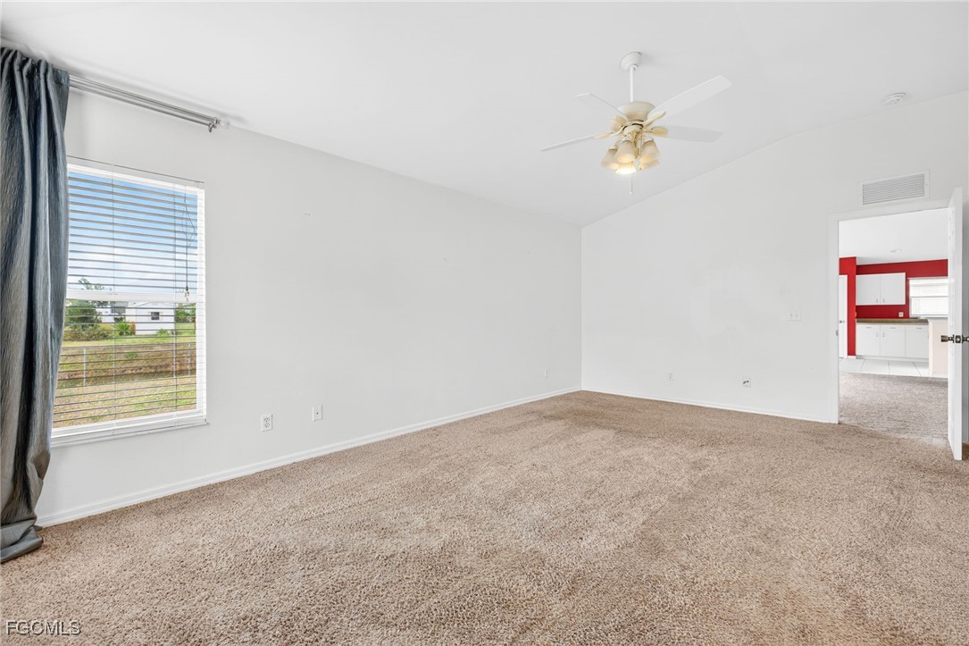 4664 Varsity Circle Lehigh Acres, FL 33971 - Photo 18 of 31 a view of an empty room with a window