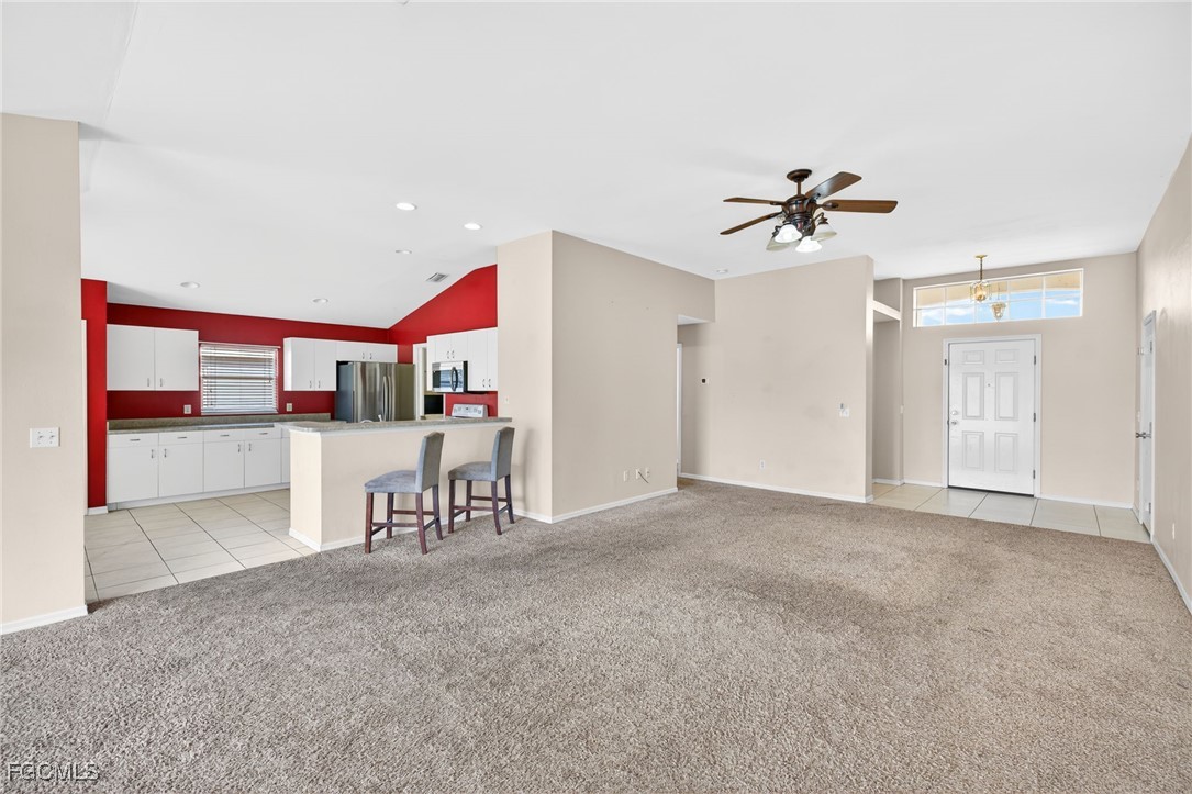 4664 Varsity Circle Lehigh Acres, FL 33971 - Photo 25 of 31 a view of a livingroom with furniture and a ceiling fan