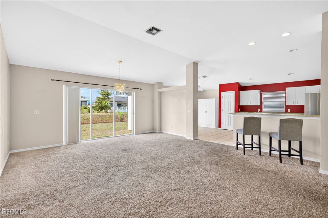 4664 Varsity Circle Lehigh Acres, FL 33971 - Photo 8 of 31 a view of an empty room with furniture and window