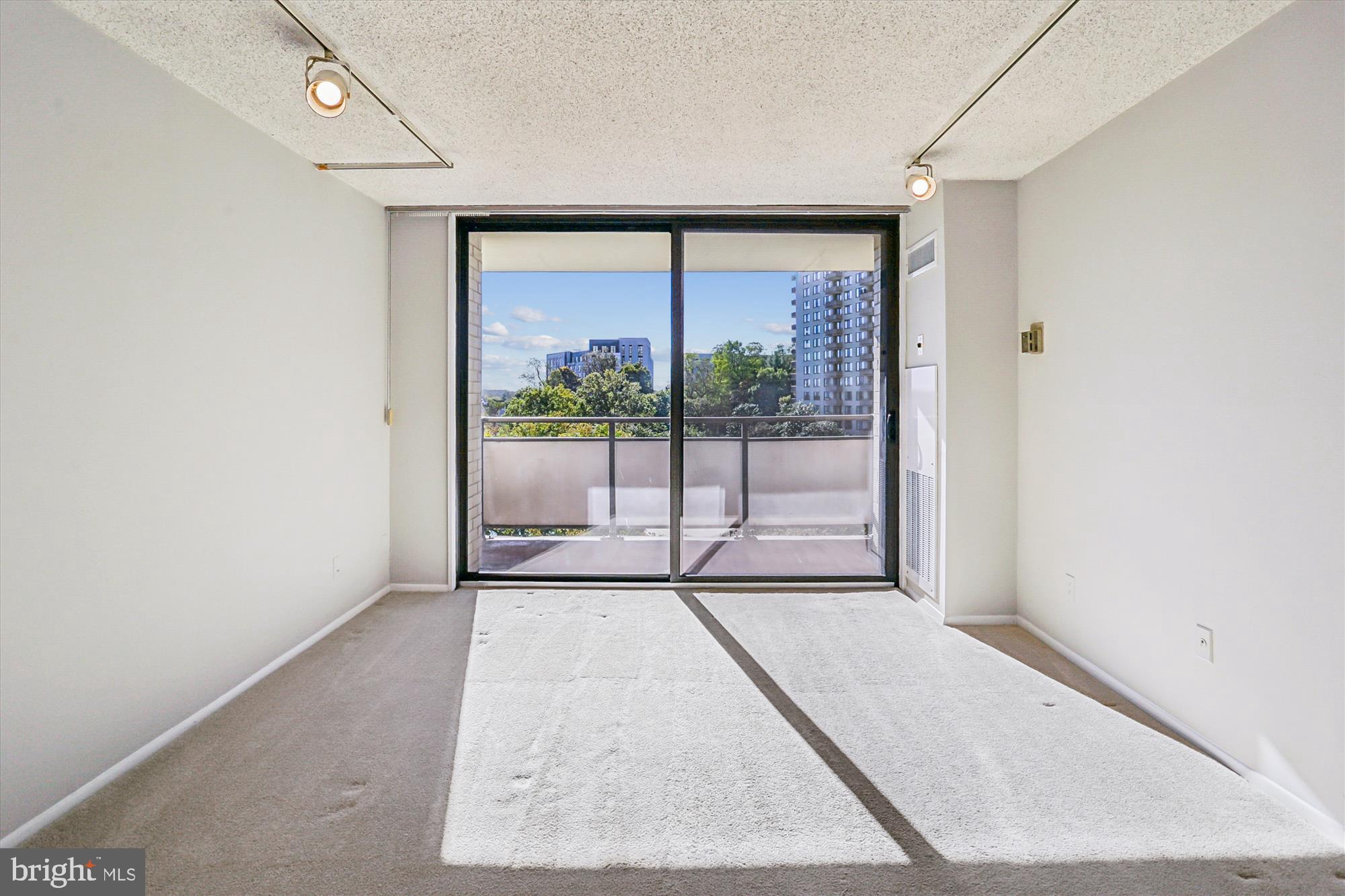 5225 Pooks Hill Road, Unit 417N Bethesda, MD 20814 - Photo 11 of 58 an empty room with a large window