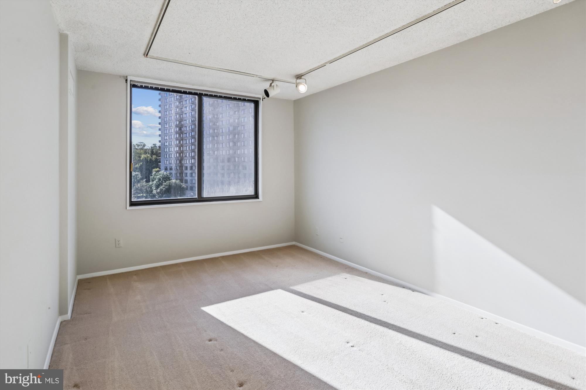 5225 Pooks Hill Road, Unit 417N Bethesda, MD 20814 - Photo 17 of 58 a view of an empty room with a window