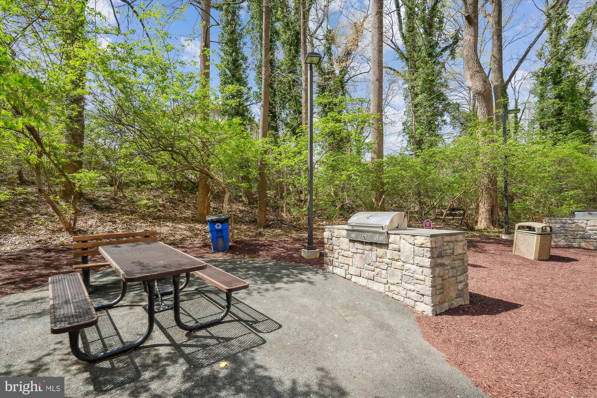 5225 Pooks Hill Road, Unit 417N Bethesda, MD 20814 - Photo 48 of 58 a view of a chairs and table in backyard