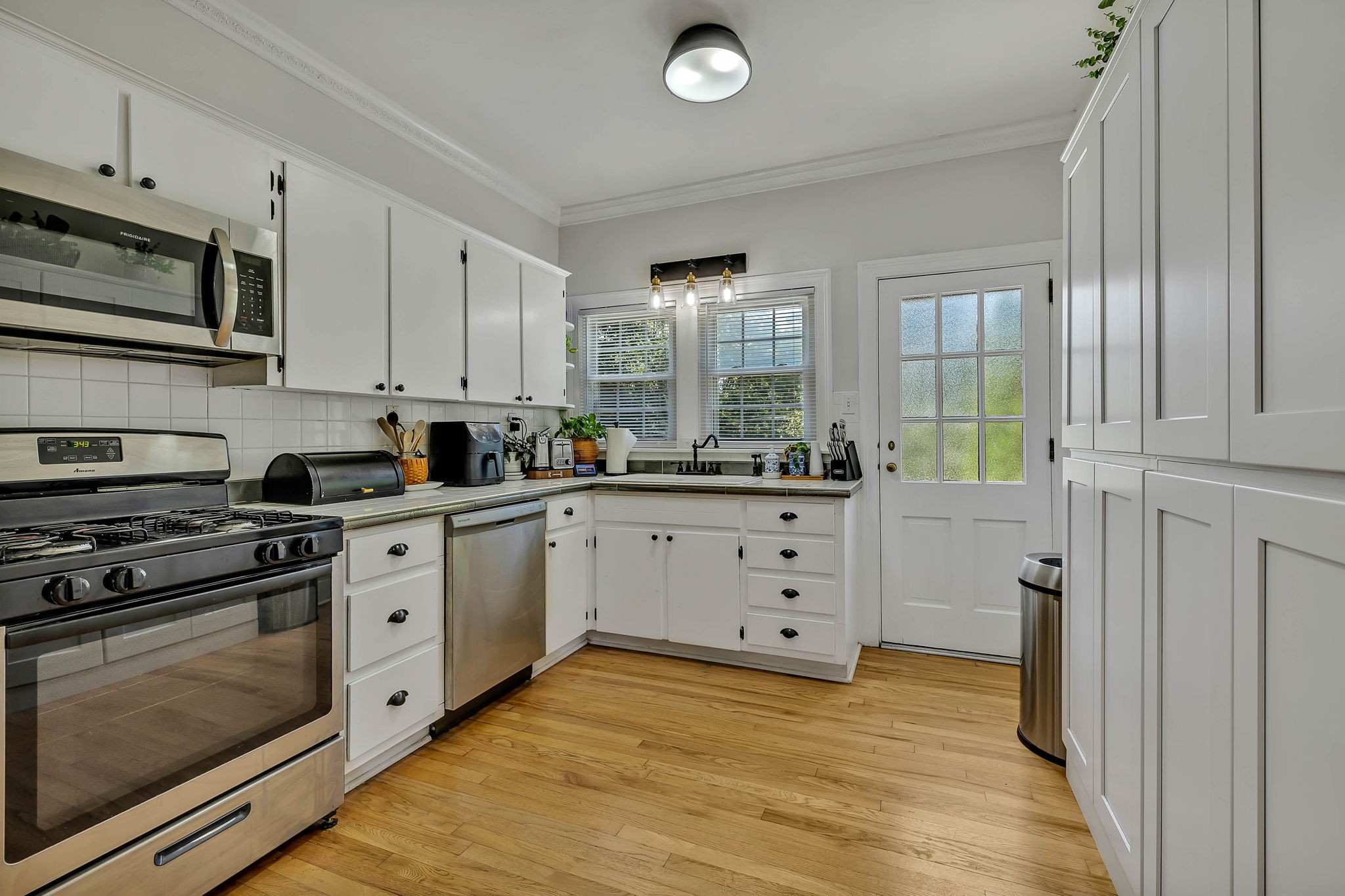 301 Cullum Street Carthage, TN 37030 - Photo 16 of 42 a kitchen with stainless steel appliances white cabinets and a stove