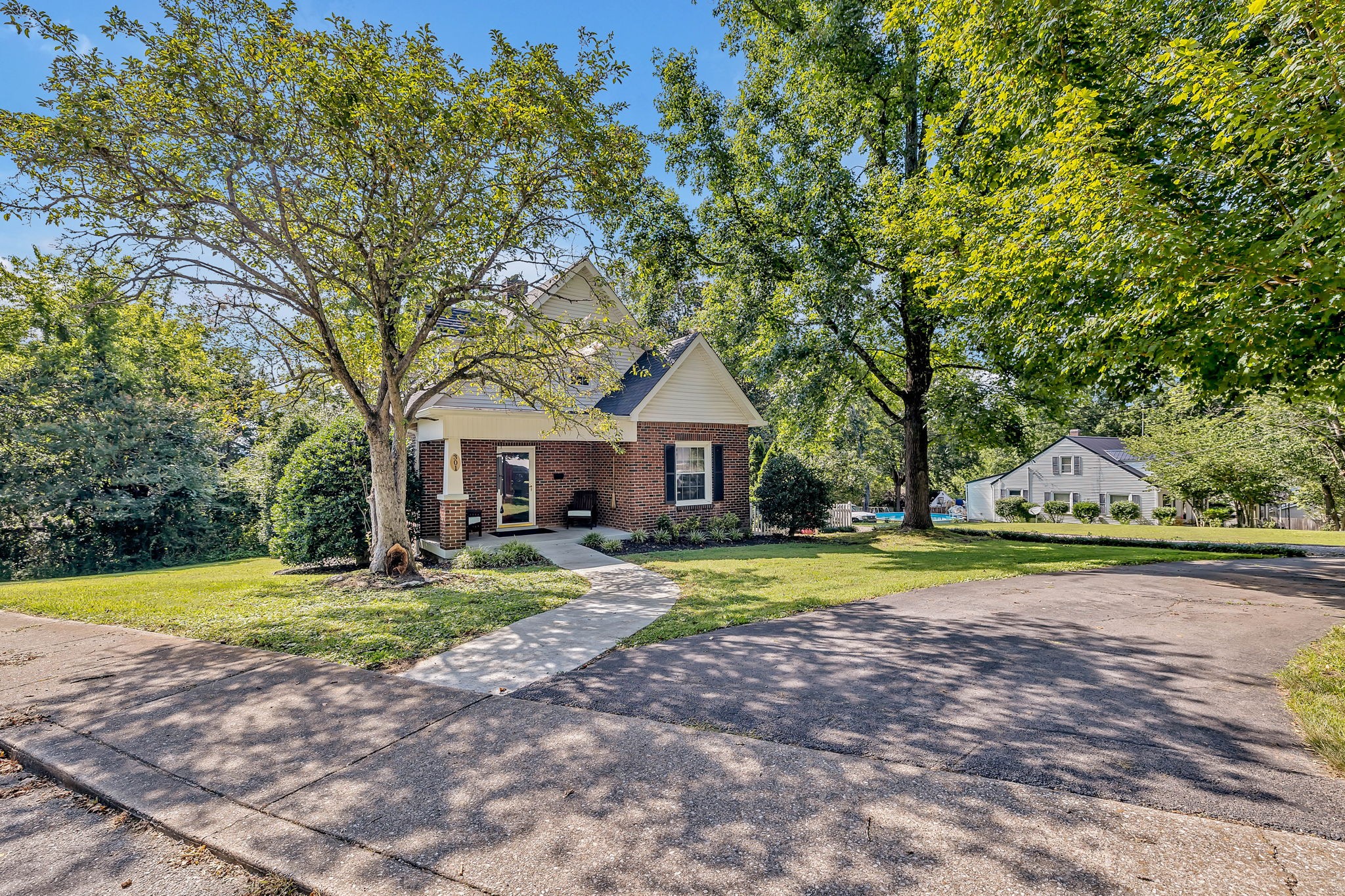 301 Cullum Street Carthage, TN 37030 - Photo 3 of 42 a front view of a house with a yard and trees