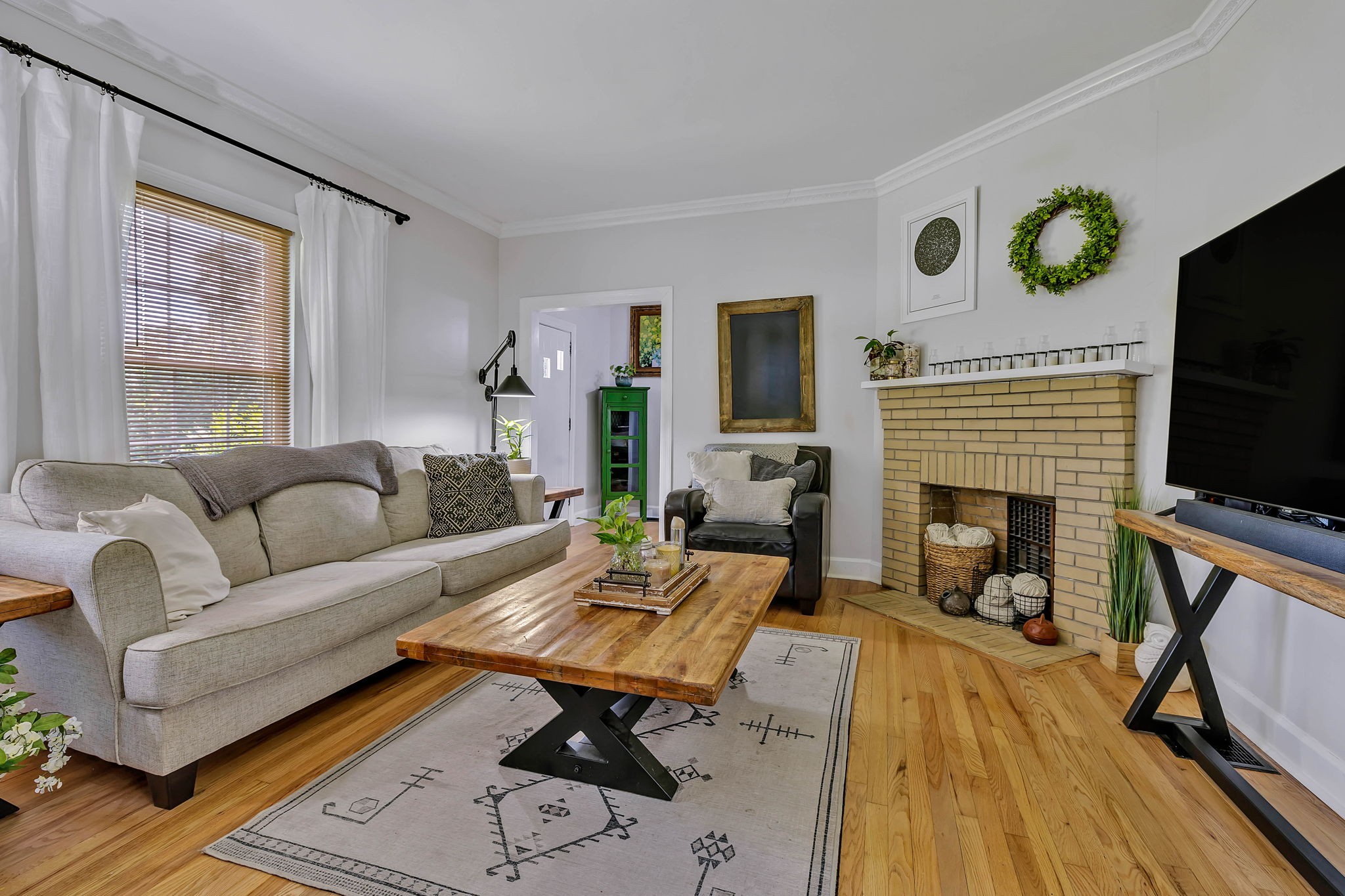 301 Cullum Street Carthage, TN 37030 - Photo 8 of 42 a living room with furniture a flat screen tv and a fireplace