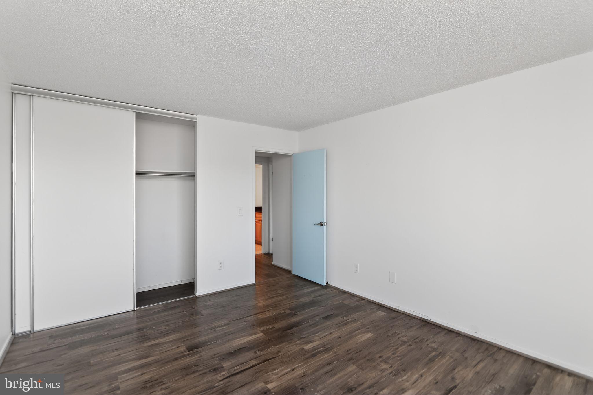 6101 Edsall Road, Unit 1704 Alexandria, VA 22304 - Photo 22 of 33 a view of an empty room with wooden floor