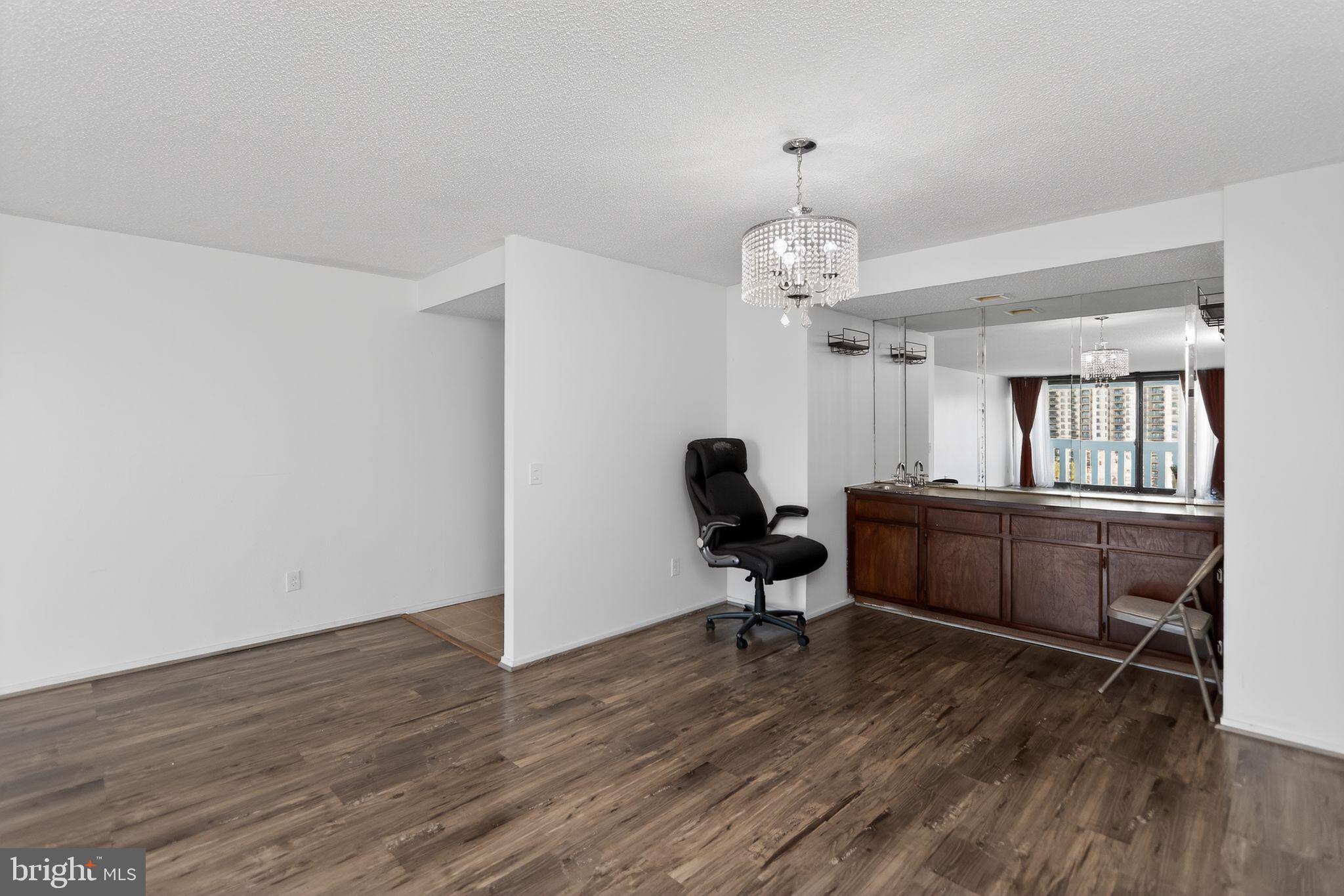 6101 Edsall Road, Unit 1704 Alexandria, VA 22304 - Photo 8 of 33 a workspace with wooden floor