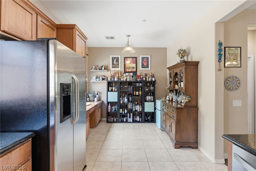 4650 Ranch House Road, Unit 126 North Las Vegas, NV 89031 - Photo 14 of 44 kitchen is equipped with ceramic tile flooring, spacious nook and built-in desk.