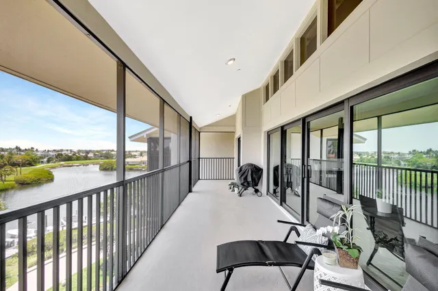 a view of balcony with furniture