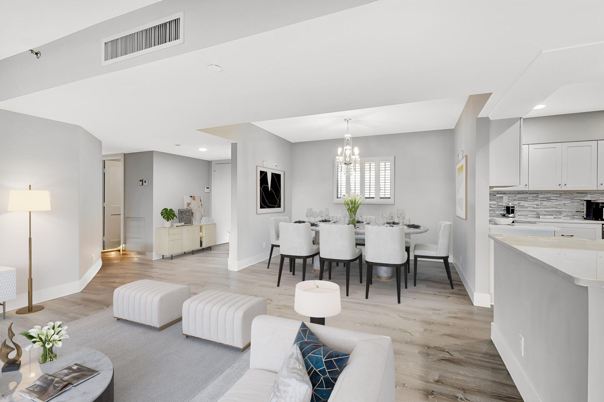 16940 Bay Street, Unit N505 Jupiter, FL 33477 - Photo 2 of 39 a large room with lots of white furniture