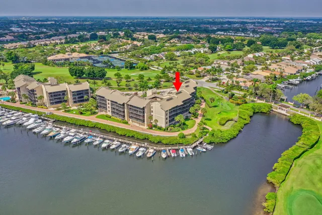 a front view of house with lake view and boat
