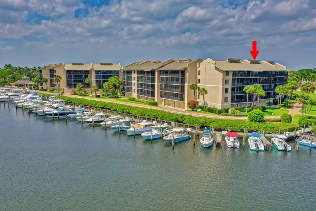 an aerial view of a house with a lake view