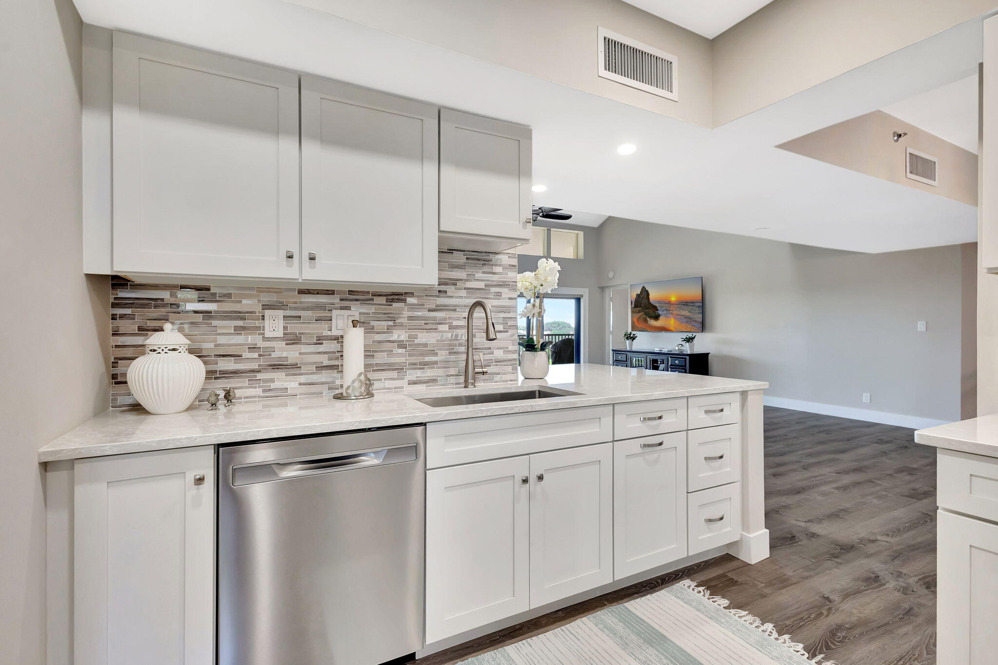 16940 Bay Street, Unit N505 Jupiter, FL 33477 - Photo 5 of 39 a kitchen with cabinets appliances and a sink