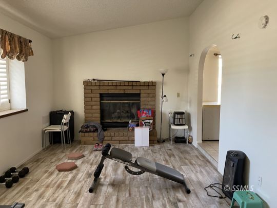 118 Chambers Street Ridgecrest, CA 93555 - Photo 2 of 16 a living room with furniture and a flat screen tv